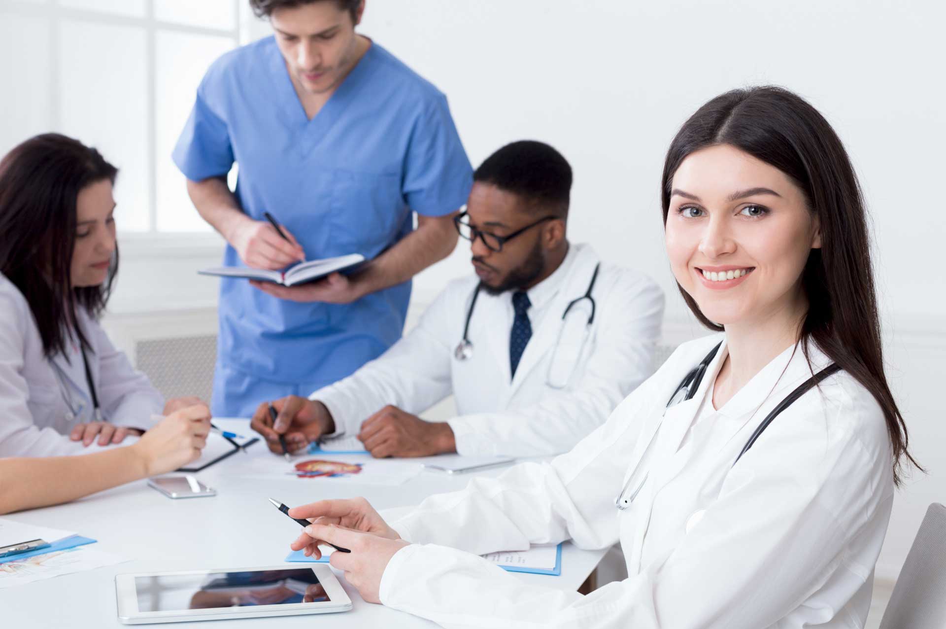 team-of-doctors-having-meeting-in-medical-office-24TWHC6.jpg