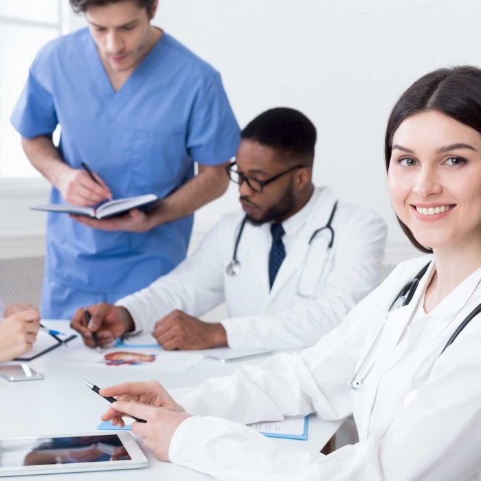 team-of-doctors-having-meeting-in-medical-office-24TWHC6.jpg